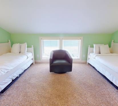 Daybed room with views of the beach