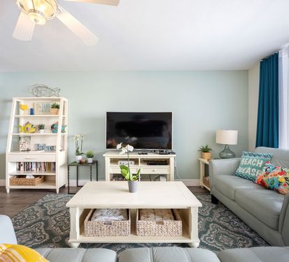 ??? "Relax in Style. The living area features two comfortable leather couches, a recliner, and a large smart TV—perfect for movie nights, cozy conversations, or simply unwinding after a day at