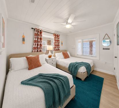 Room for two (or 4) with two full beds, a ceiling fan, and coastal
curtains complete with a flat screen TV to stream movies. Ideal for
kids sharing a room or friends traveling together who need their own space.