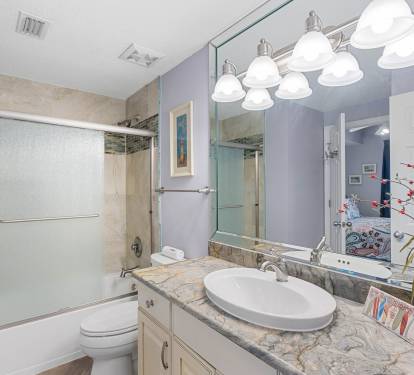 Spacious condo bathroom w/ extended vanity & plenty of room to get ready.