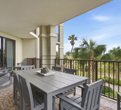 Rocking chairs and settee with coffee table round out the huge patio.
