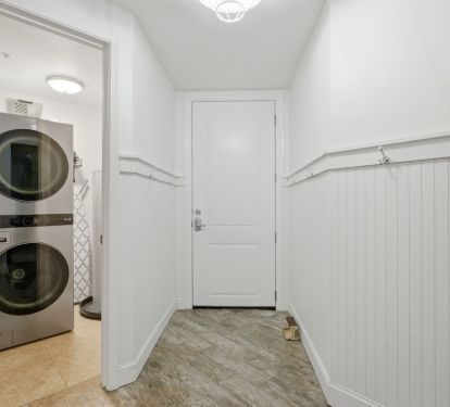 Foyer with laundry and beach toy storage.