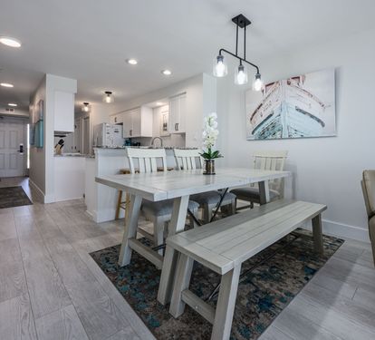 "Dine with a view! This open-concept space effortlessly flows into the living room and balcony, showcasing endless Gulf waters. ????? #OceanfrontDining #CoastalLiving"