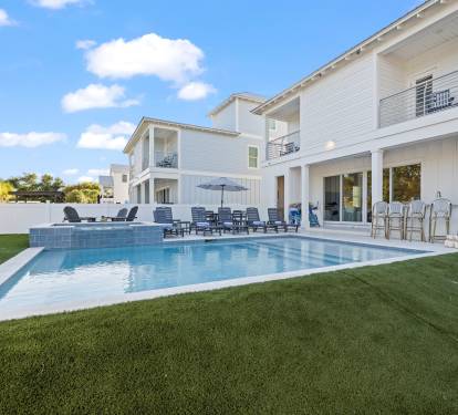 Salt water pool and hot tub with a lounging step
