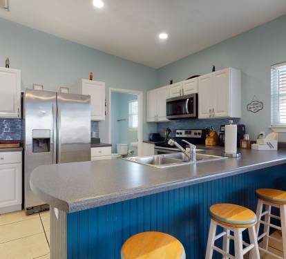 Extra seating at the kitchen island and fully stocked kitchen