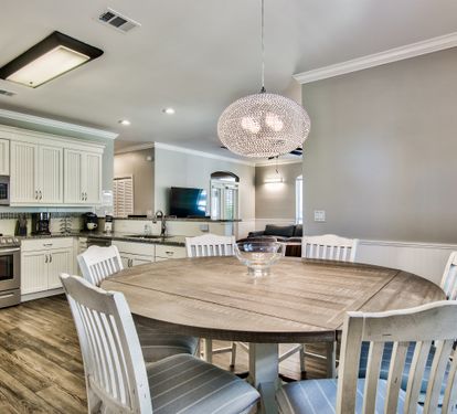 Dining area with seating for six and coastal-inspired décor