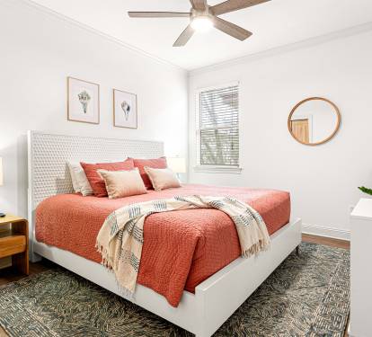 Sunlit and spacious. This bedroom feels like a relaxing space to unwind, not an afterthought.