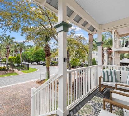 The entrance to one of two neighborhood pools can be seen from the porch.