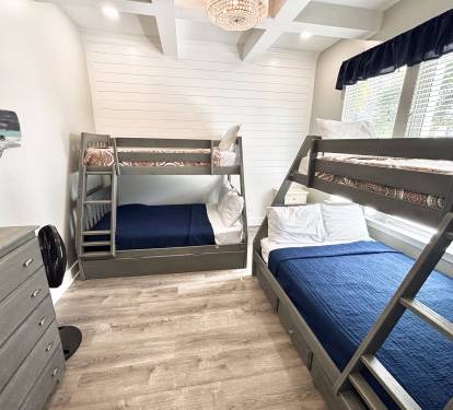 Bunk room with 2 full size beds, 2 twin beds, and a trundle.