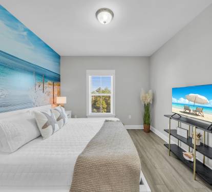 Bedroom 2 offers a bamboo KING bed with 4 king pillows for your dreamy night sleep.  It also includes an ensuite bathroom for your privacy.  The mural brings you to the beach while you drift away to ocean sounds on the white-noise machine.