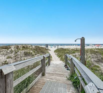 Multiple Beach Accesses with showers and hoses.