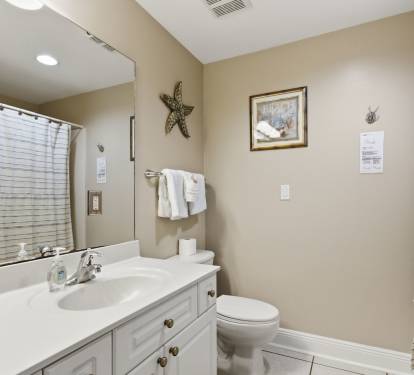 Double sinks and a tub with shower in the master bath. 
