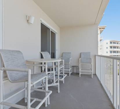 Our large balcony w/ lots of seating (additional table and chairs not pictured) 