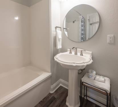 Clean bathroom featuring a sink and timeless finishes.