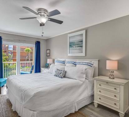 Bright and Breezy King Bedroom - Unpack and
unwind in this spacious retreat with light tones,
blackout curtains, and direct balcony access.