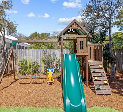 A backyard build for play, soft turf, a swing set, and a space place for the little ones to burn off energy.