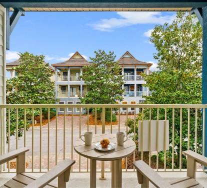 The second floor balcony is where the adults retreat. Grab a drink, catch the Gulf breeze, and let the kids play below.