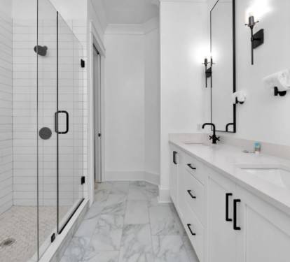 Ensuite bathroom with two sinks and walk in shower