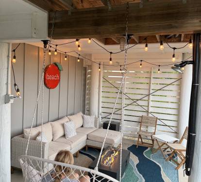 Relax with your family on cooler nights by the firepit on the patio.  You’ll sink into the wonderful sofa or enjoy snuggling into the hammock swing while the sounds of the nearby wetlands nature soothe you and your fresh catch cooks on the grill here!