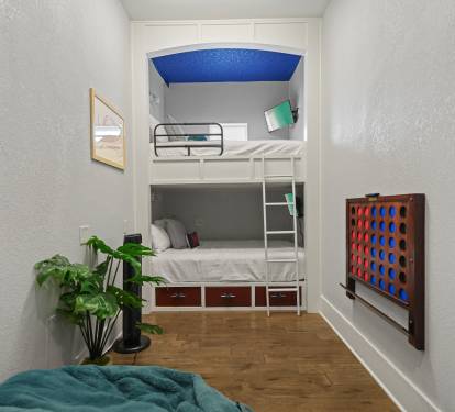 Spacious bunk room with full-over-full beds, games, and fun décor for younger guests.