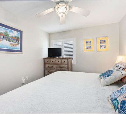 ??? "A Cozy Coastal Retreat. The guest bedroom offers a spacious king bed, stylish furnishings, and all the comforts of home—including a TV, dresser, nightstands, and a roomy closet." ???