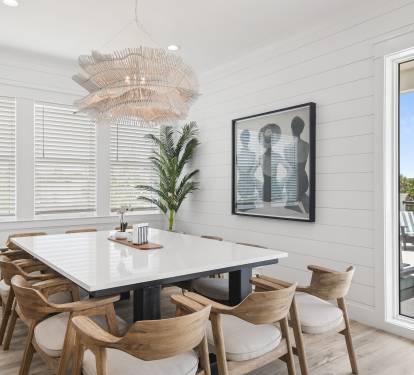 Enjoy a stylish dining space with modern art and beautiful lighting.
