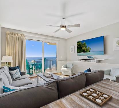 After enjoying the sun, sand and adventure, relax in your beach-inspired living room watching the 75" smart TV.