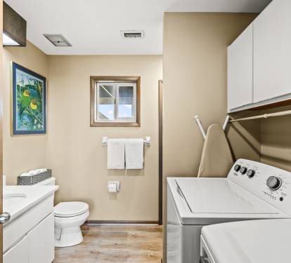 Modern and fully equipped laundry room.