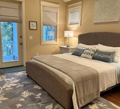 Master bedroom #1 KING seagrass bed w door leading to private treetop porch.