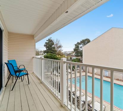 Master Bedroom Balcony overlooking 1 of 2 pools
