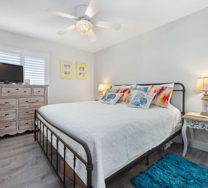 ??? "A Cozy Coastal Retreat. The guest bedroom offers a spacious king bed, stylish furnishings, and all the comforts of home—including a TV, dresser, nightstands, and a roomy closet." ???