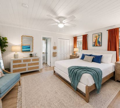 The primary bedroom gives the group leader their own retreat. A king bed, private dressers, armchairs, and arched mirror create a calm
space to come back to after the beach. Have a little one? The pack and plan and extra crib are in the closet!
