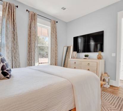 Queen bedroom with ensuite bathroom on the main level