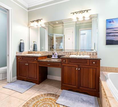 Double sink, huge tub, shower, and toilet closet in the en suite main bathroom.  