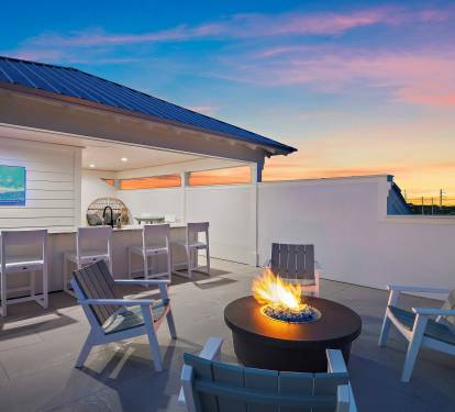 Rooftop Bar with firepit, cozy lounges and stunning gulf views!
