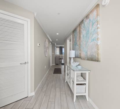 Clean hallway connecting the spaces with a bright, open feel.