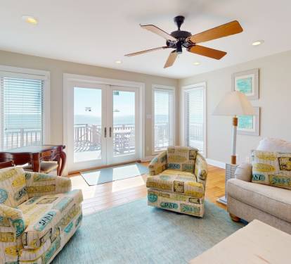 First Floor living area with doors to deck