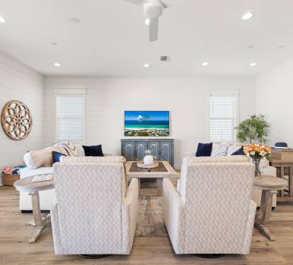 Living room has a sofa table with USB ports for easy laptop use