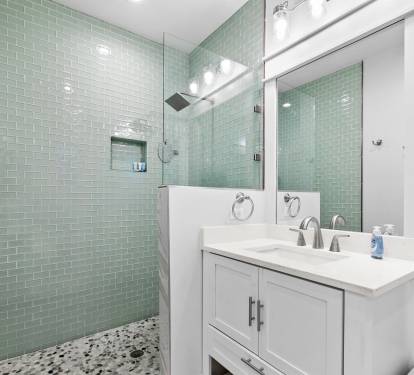 Master shower with great lighting double vanity and storage space.  in primary bedroom #1