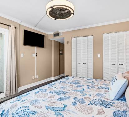 Master bedroom has a king bed, smart TV and ample clothing storage