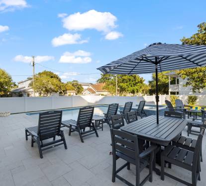 Outdoor dining table with umbrella seats 6