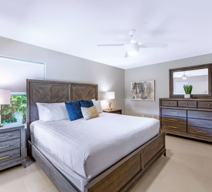 Primary bedroom has a king size bed