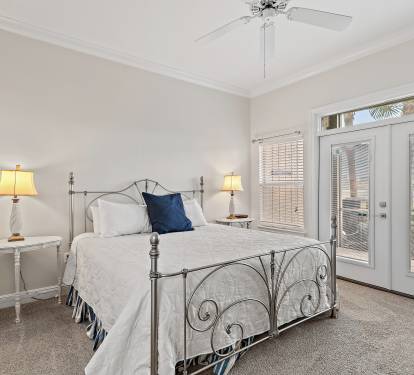 Master BR w/king bed, leads out to a screened in patio