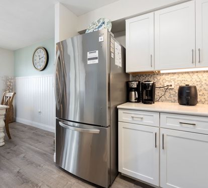 ?? "A Chef’s Dream. This updated kitchen features sleek granite countertops, a stunning tile backsplash, and stainless steel appliances—including a stove, refrigerator, dishwasher, and microwa
