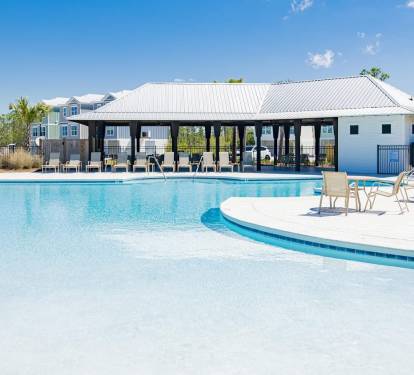 The Community Pool features a wonderful zero-entry area, many lounge chairs for the whole family to enjoy, and a beautiful pavilion to enjoy a snack or lunch and get out of the sun a while.