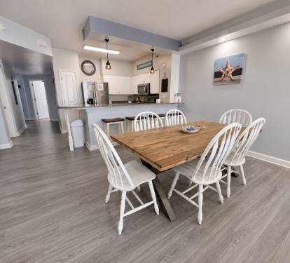 Dining room table sits 6 and 4 at the kitchen counter 