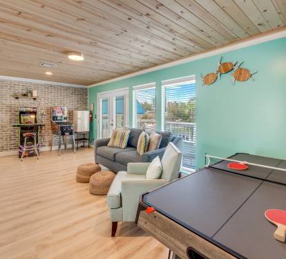 The Game Room is located on the second level  and includes Teenage Mutant Ninja Turtles arcade game, Marvel pinball machine, air hockey/ping pong table, mini fridge, and game stick with countl