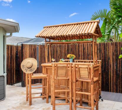 Tiki Bar with Outdoor Shower.  Relax at the tropical tiki bar, complete with an outdoor shower for added convenience after a swim or a day in the sun.