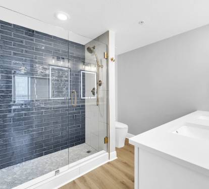 Completely renovated with elevated finishes, this primary en suite features a spacious walk-in tile shower and a comfort-height toilet for added comfort.