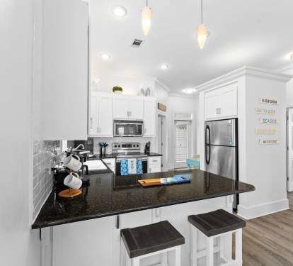 Two bedrooms and a second bathroom are just beyond the kitchen.